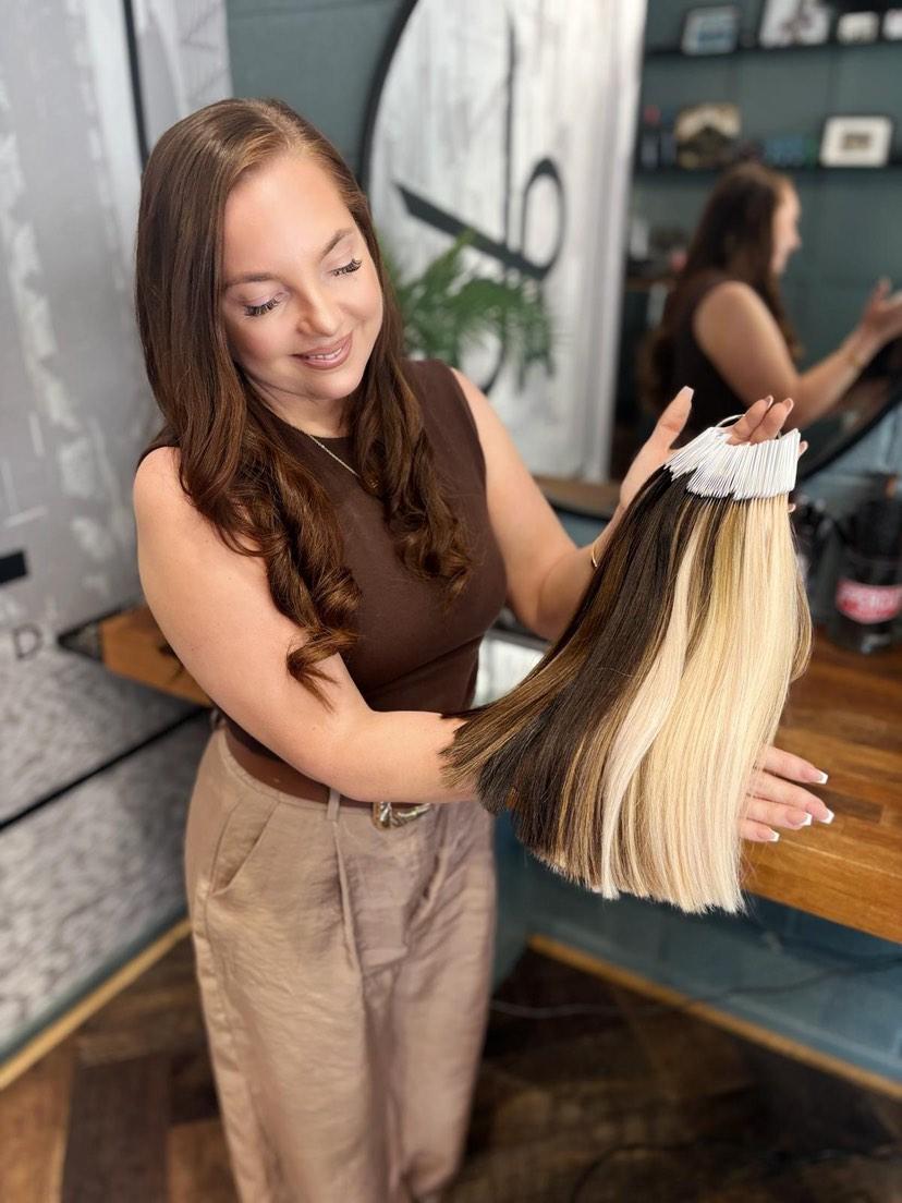 Cleo, the founder of Cleo Extended, a hair extension specialist.