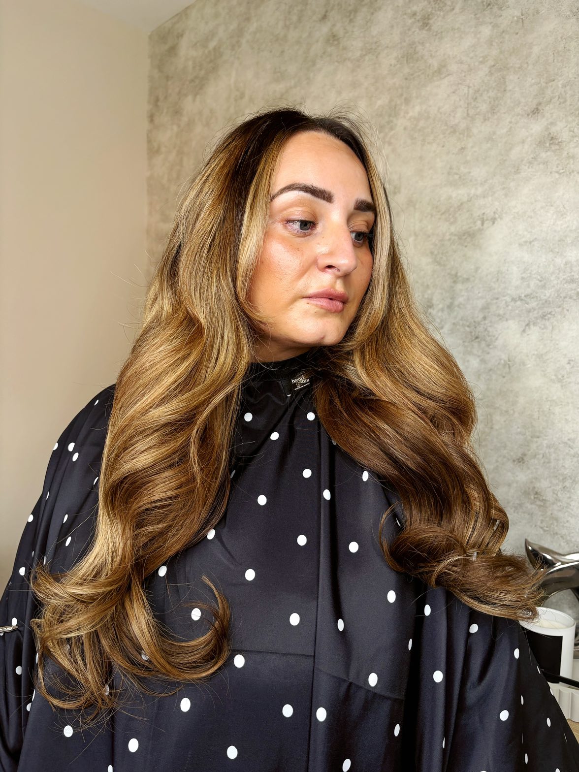 Voluminous hairstyle achieved with nano extensions.